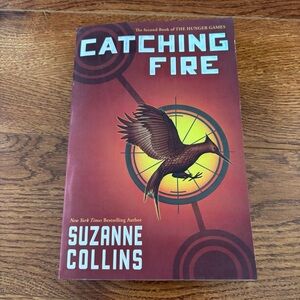 Catching Fire by: Suzanne Collins Paperback book
